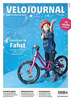 Mit Kindern auf grosser Fahrt. Velojournal Titelbild. Ein Kind spielt mit Seifenblasen.