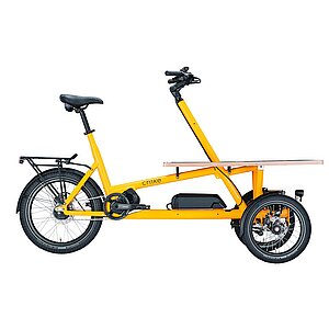 Cargobike Typenkunde. Gelbes Latenrad mit drei Rädern vorne.